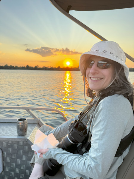 Cathy on the Zambezi River cruise at sunset