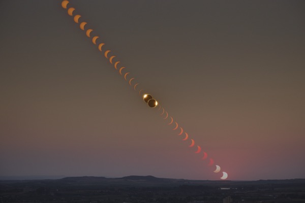 Total solar eclipse time lapse showing partials, totality, and sunset