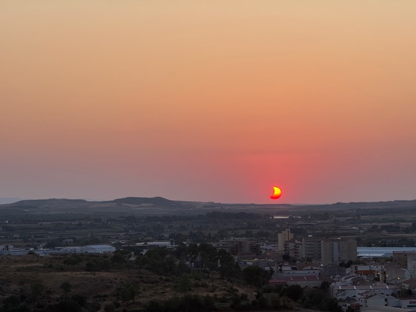 The setting red crescent sun