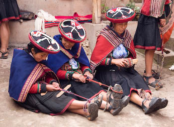 three women weaving